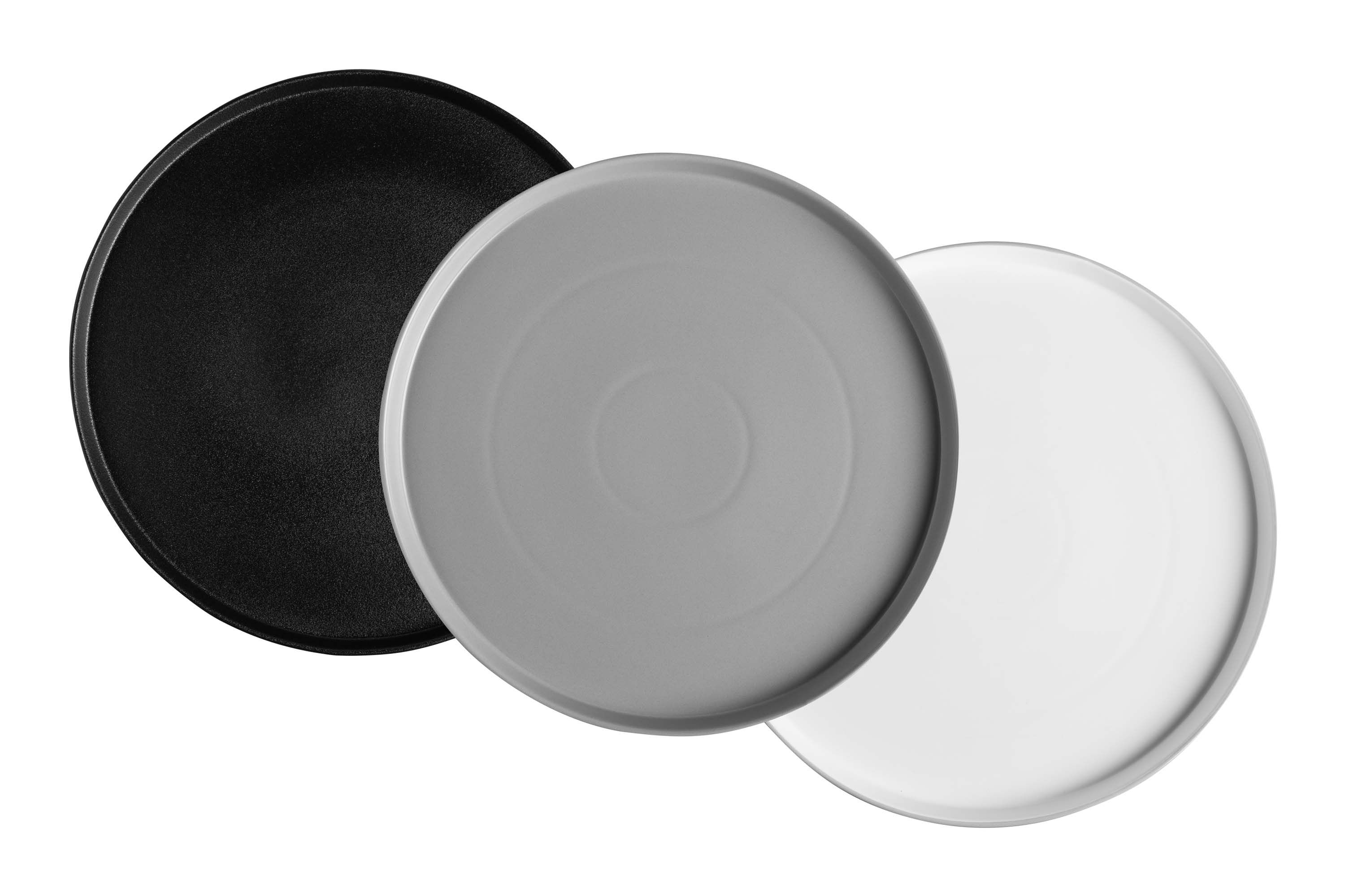 Drei runde Servierplatten in schwarz, weiß und grau
