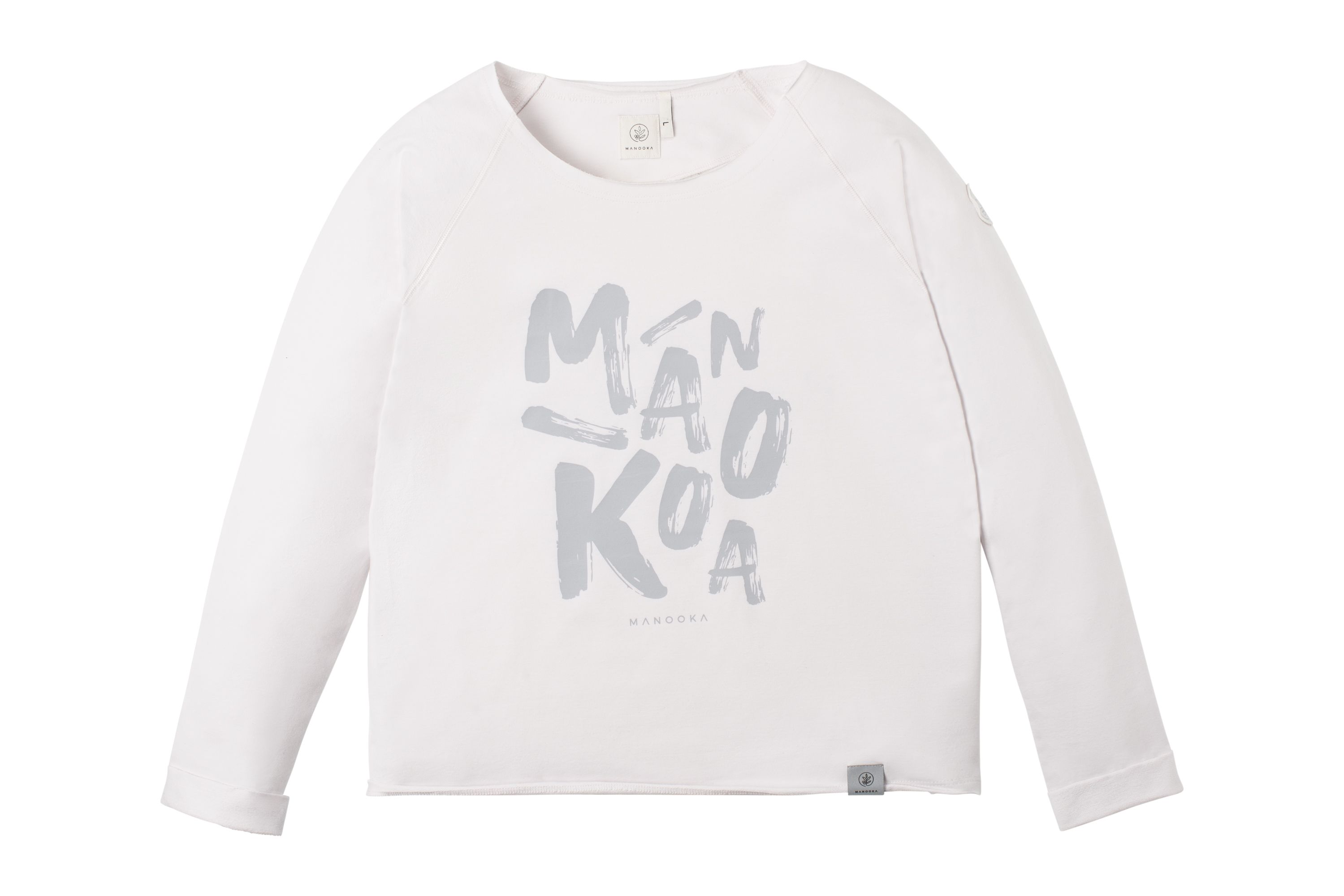 Ein weißes Nadia-Sweatshirt mit Manooka-Schriftzug